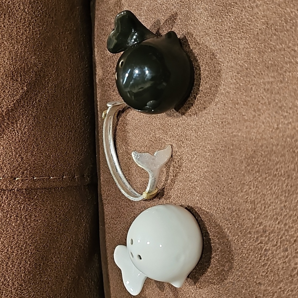 Adorable salt & pepper shakers & a whale tail cuff bracelet. All new.